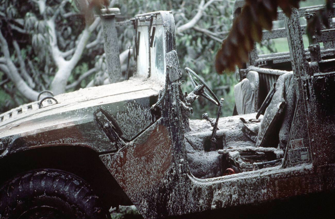 An M998 HMMWV covered in ash at Papaga Agricultural College, Philippines, after Mount Pinatubo’s eruption, with over 20,000 evacuees removed.