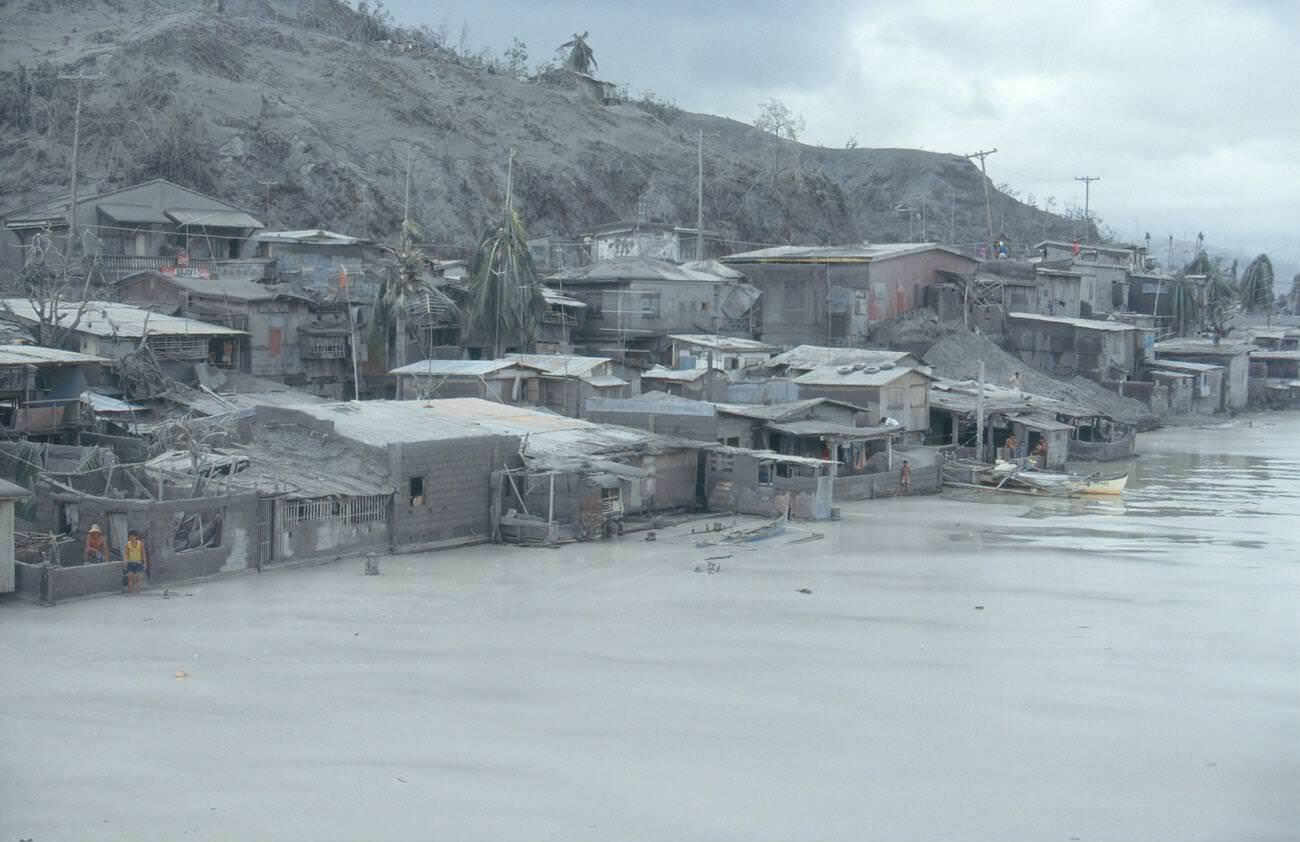 A village on Subic Bay’s coastline, Philippines, blanketed in ash following Mount Pinatubo’s eruption.