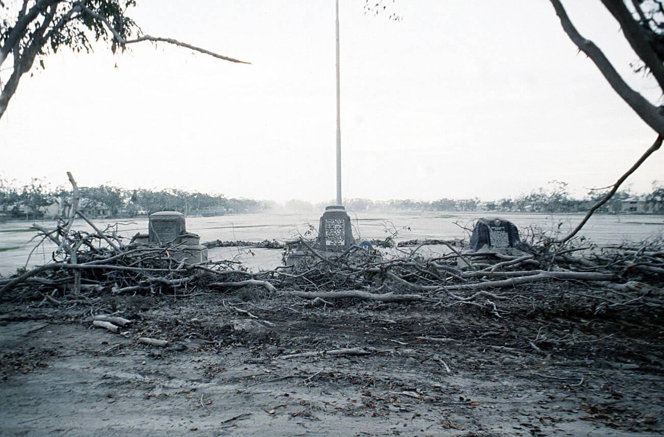 The 13th Air Force parade ground at Clark Air Base, Luzon, Philippines, with damaged trees and an ash-covered landscape after Mount Pinatubo’s eruption.