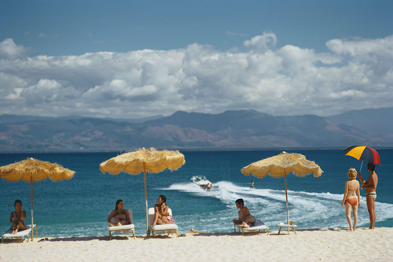 #30 Guests on the beach of a private island owned by Philippine Airlines President Benigno Toda Jr., Philippines, February 1973.