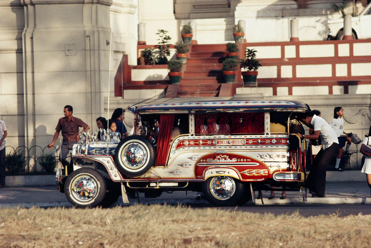 #36 A crowded jeepney picks up passengers in Manila, Philippines, 1974.