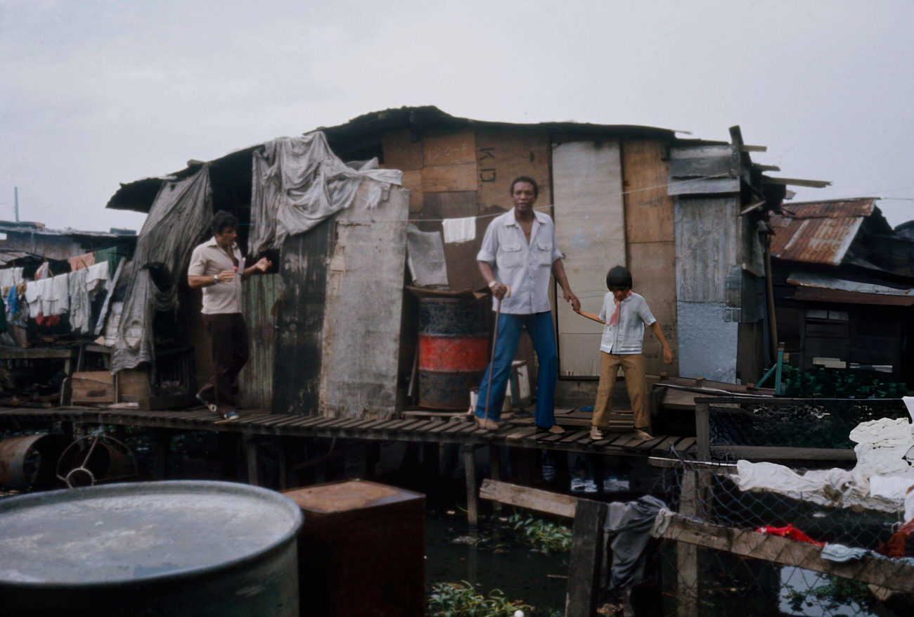 #38 Jonathan Goldsmith and Paul Winfield among extras in the ABC TV movie ‘Green Eyes,’ Philippines, 1977.