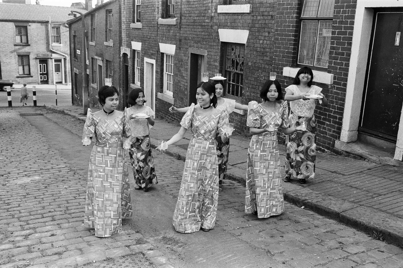 #5 Women from Manila working in a mill in Rochdale, Lancashire, showcasing national dancing on 20th July 1972.