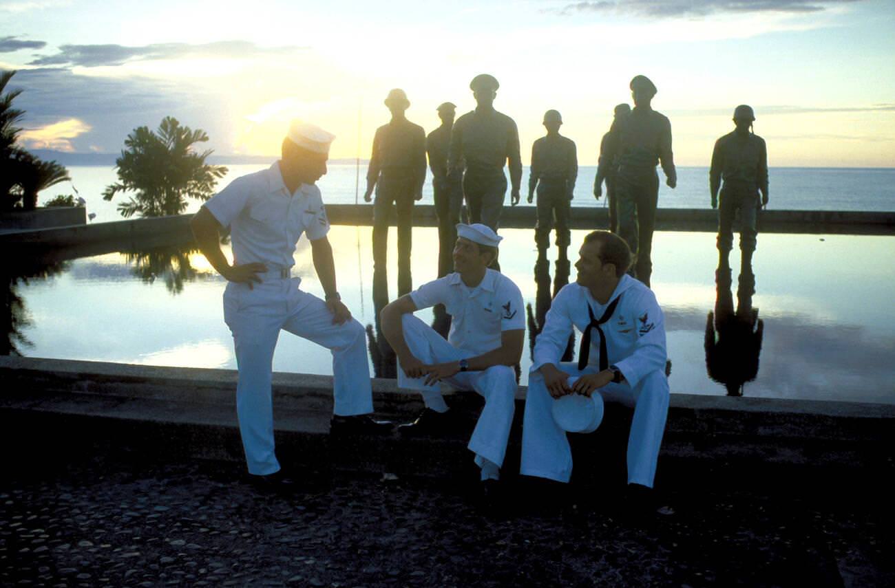 #47 Crewmen from USS CONSERVER relax by a monument to GEN Douglas MacArthur, 1981.