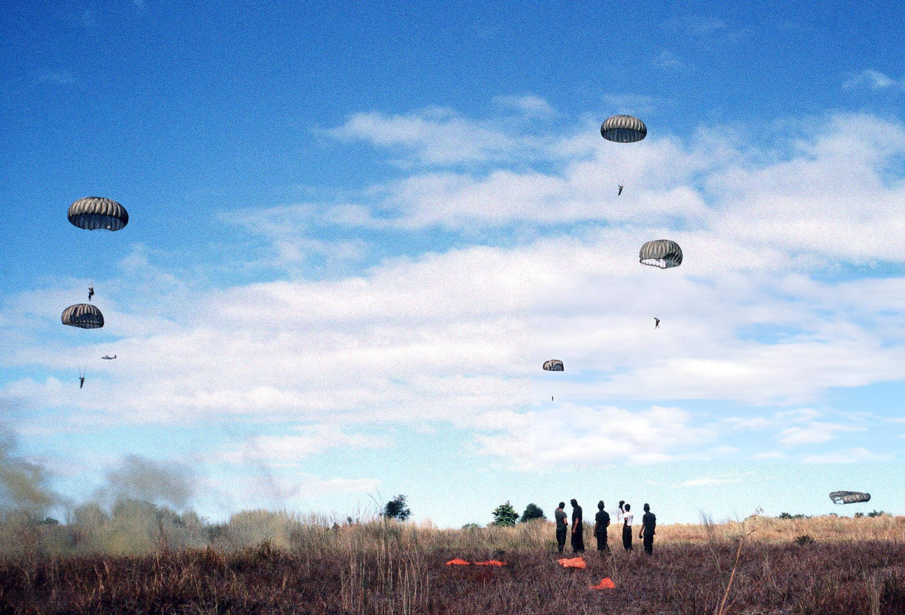 #59 Philippine army paratroopers descend to a drop zone from a 374th Tactical Airlift Wing aircraft.