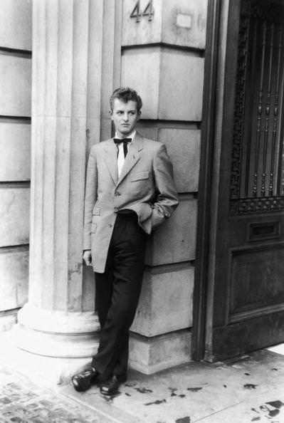 #12 Alec Cruickshank, a clerk in a City of London shipping office poses ready to go into Mecca’s Royal Dance Hall, Tottenham, on 29th May 1954.