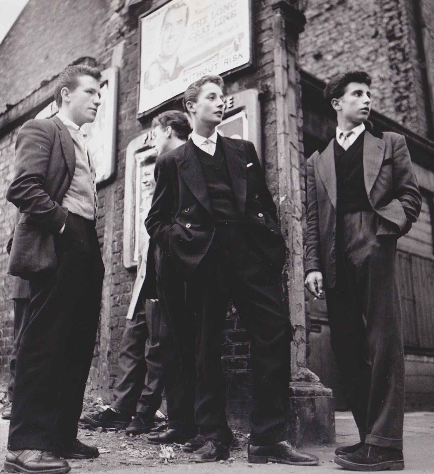 #13 Teddy Boys gather outside a Picture House on the Old Kent Road, 1955.