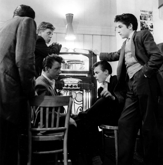 #17 A group of Teddy Boys congregate around a jukebox, London, England, July 1955. o.