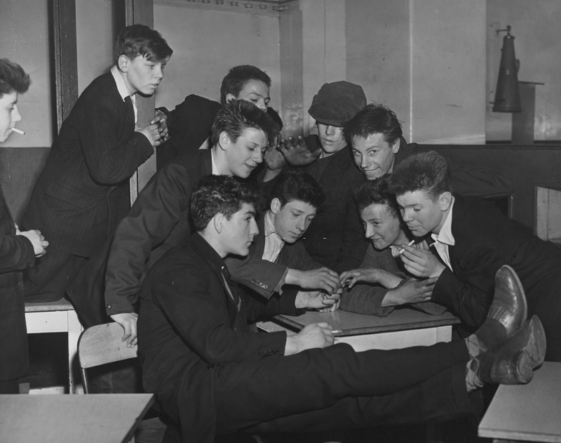 #20 A group of Teddy Boys smoking cigarettes at the Rodney Youth Centre in Liverpool, April 1956