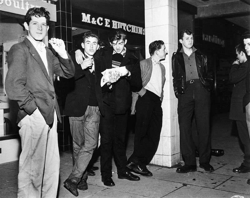 #22 The fish and chip shop, the youths main meeting place in the new town of Newtown Aycliffe, Durham, October 1959.