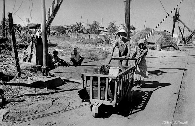 #59 Filipinos citizens fleeing the fighting. Manila, Philippines, Feb. 1945.