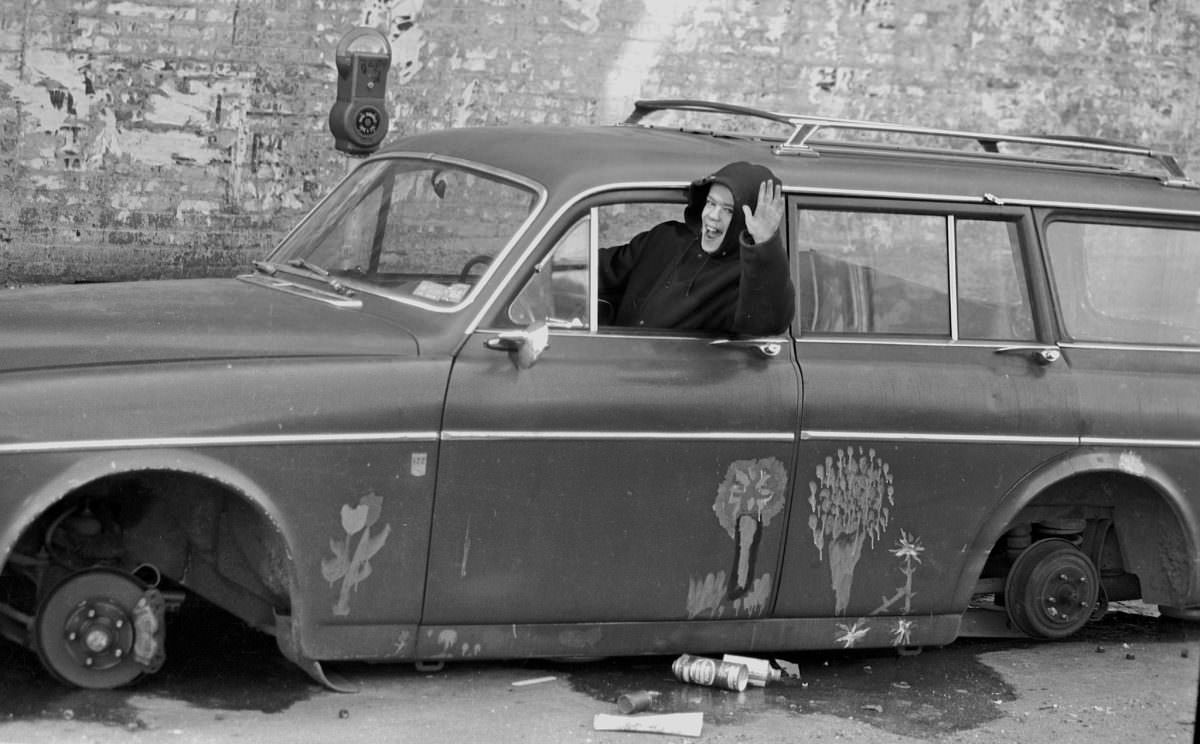 #20 Fernando with his first car on East 3rd Street, 1976.