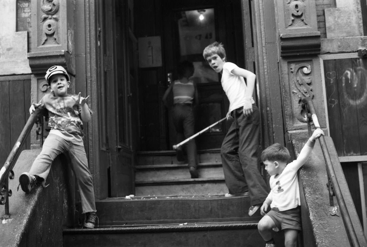 #12 Lil Steve, Orlando, Fernando, and someone on East 3rd Street, 1975.