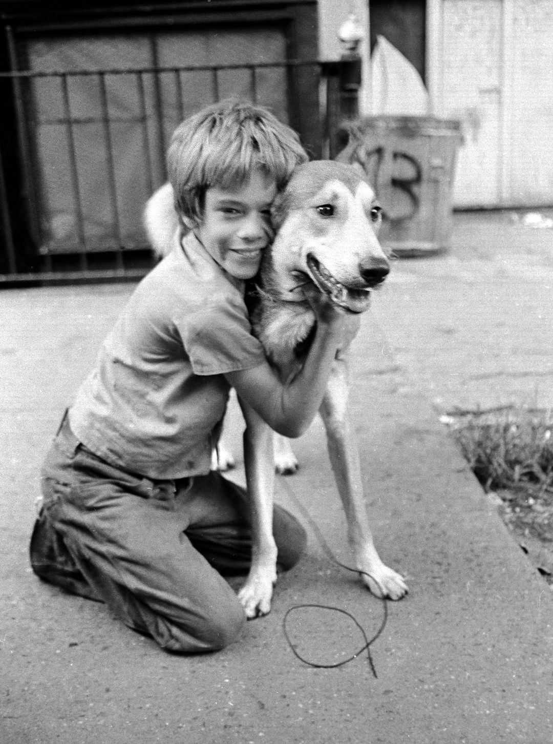 #27 Fernando Finds His First Dog on East 3rd Street, 1974.