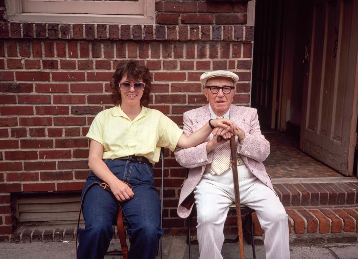 #2 Mr Katz and Meryl Meisler sitting outside his appartment house on the Lower East Side, 1977