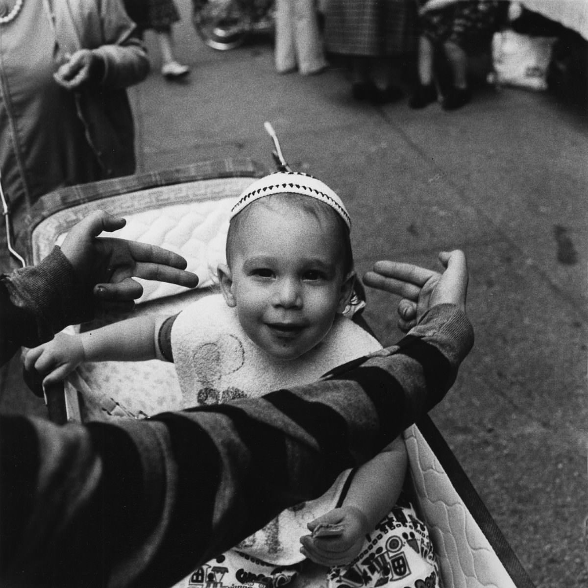 #7 A future Talmudic student being pointed out by my photography student Michael Marsh at The Lower East Side Street Festival, 1978