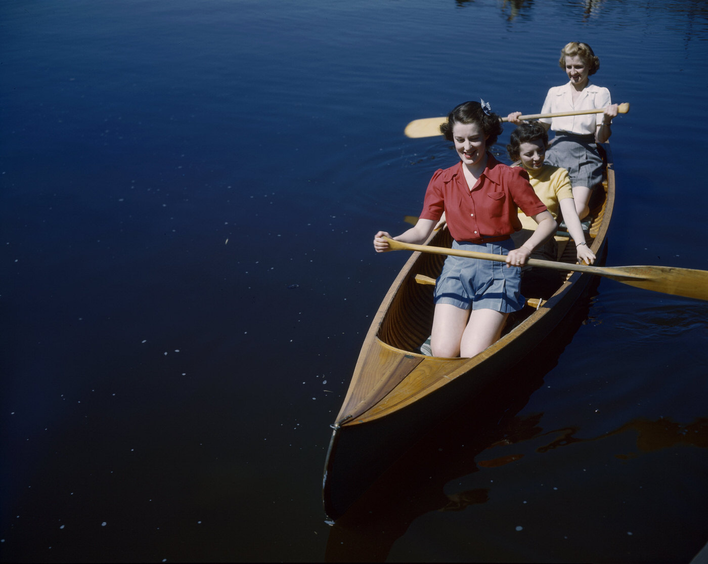 #29 Three women in the Canadian Army paddling a canoe, Canada