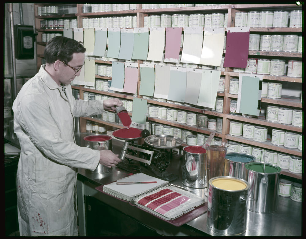 #31 Paint technician Jean Bedard is tinting in the Control Laboratory at Ottawa Paint Works, Ontario ,1955