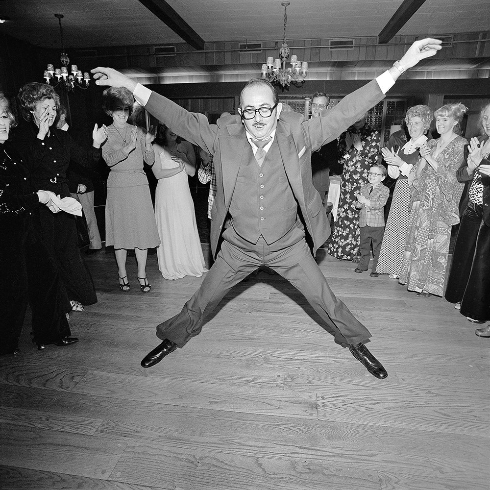 #20 Meryl Meisler Man in a 3 Piece Suit Dancing Within the Circle at a Wedding, Rockville Centre, 1976