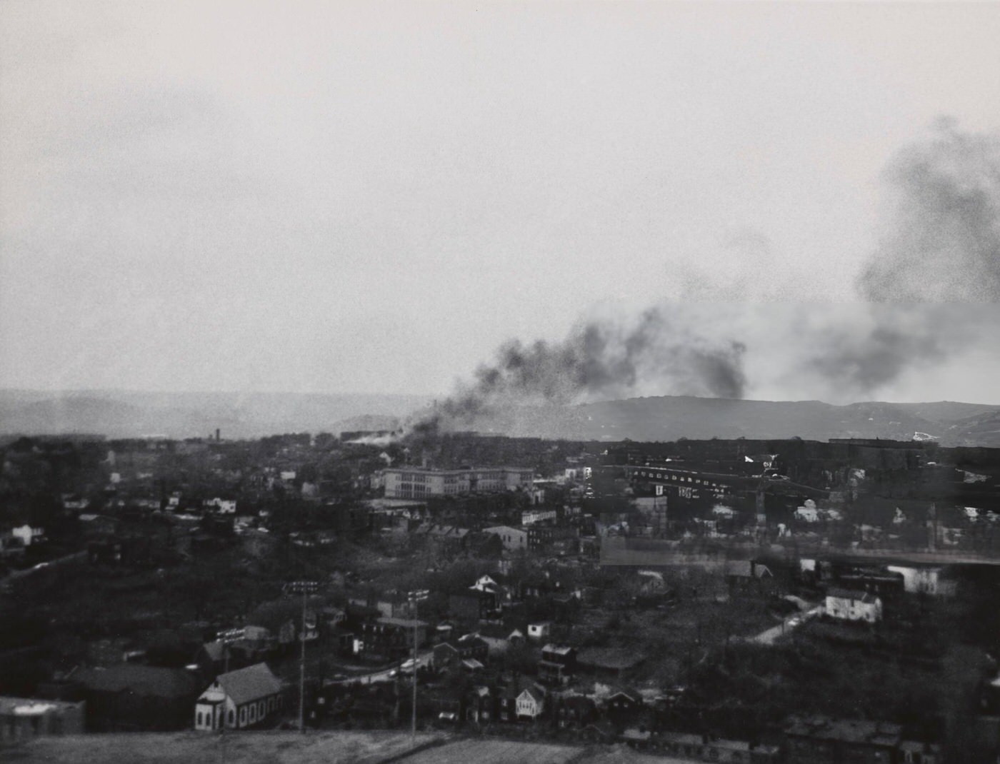 #16 Smoke rises from the city