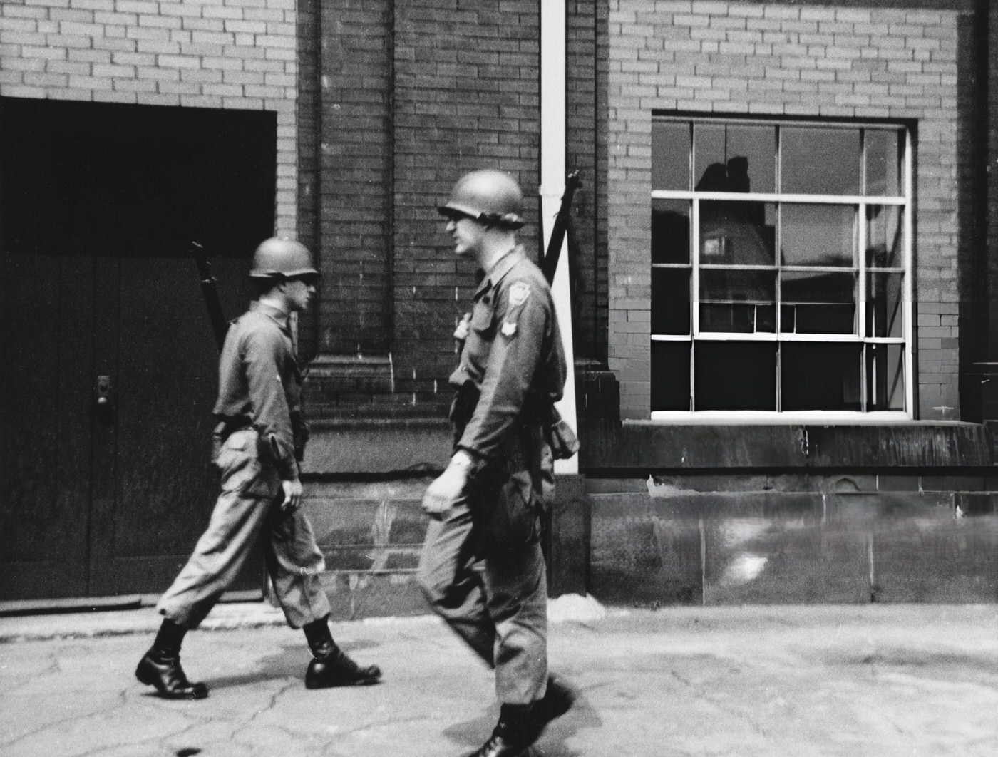 #22 Armed officers of the National Guard patrol the streets