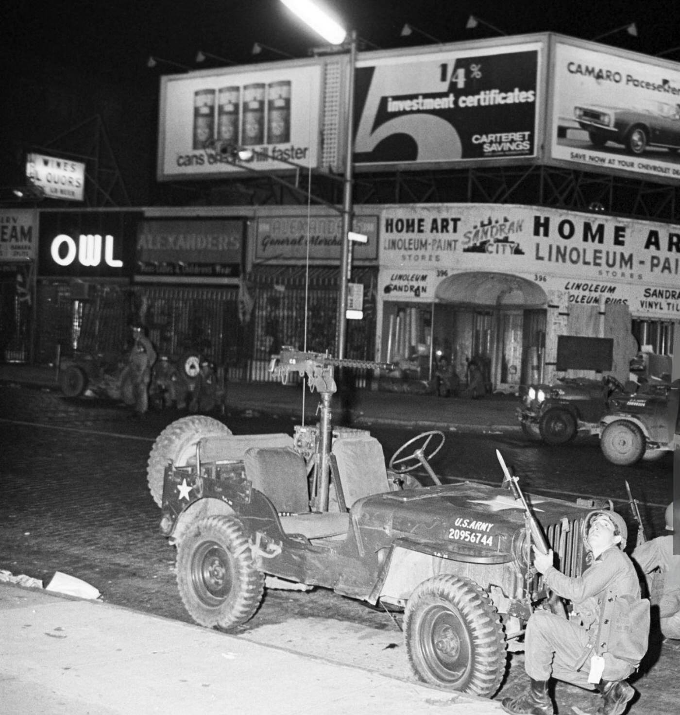 #52 National Guard soldiers in ambush behind a jeep armed with a light machine gun