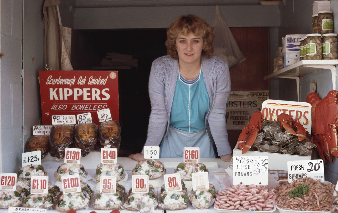 #11 A woman selling fresh seafood in Scarborough, Yorkshire, 1980s.