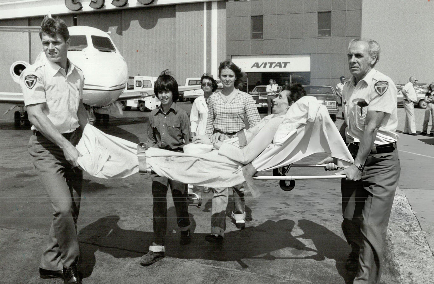 #17 Scarborough mother Shirey Chappell is carried to an air ambulance, 1980s.