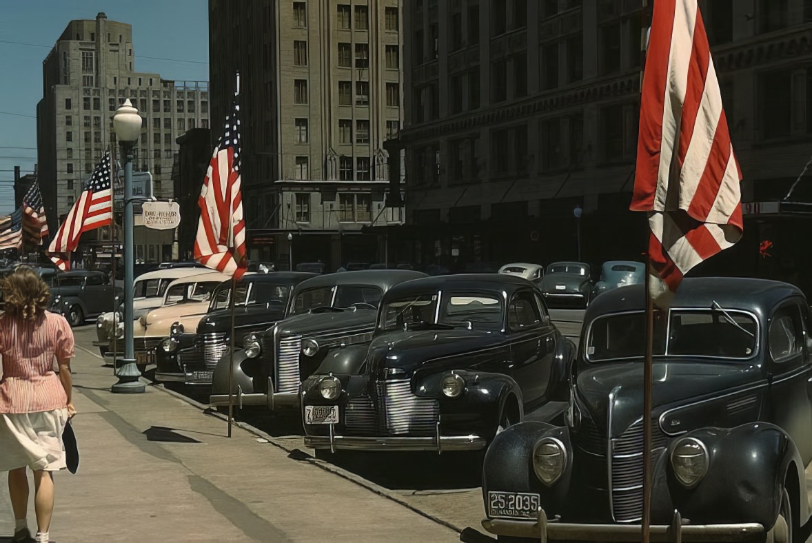 #15 Cars and American flags line the main street of Lincoln, Nebraska, in 1942.
