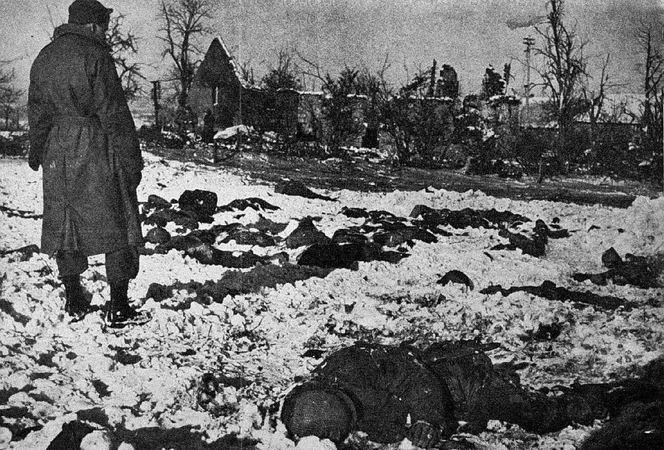 #11 Bodies of executed American soldiers, known as the Malmedy massacre, during the Battle of the Bulge, 1944.