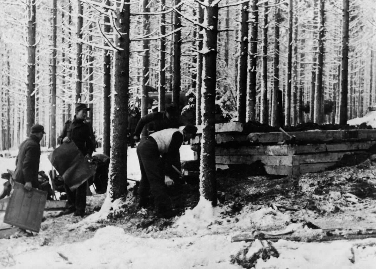 #29 Construction of a wooden bunker during the Battle of the Bulge, 1945.