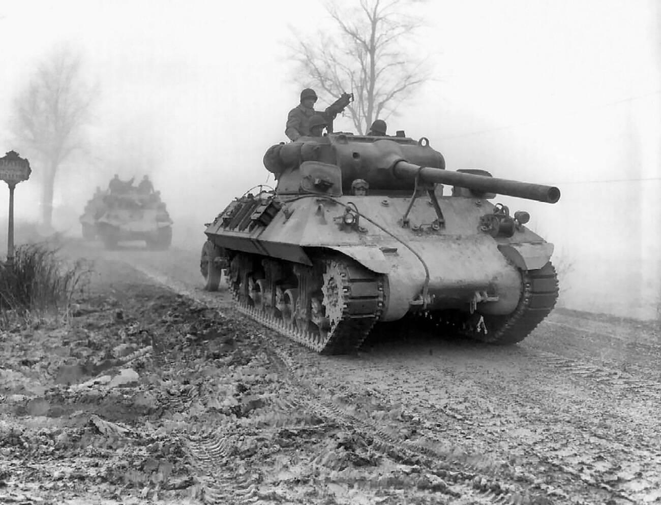 #3 American tank destroyers move forward during heavy fog to stem the German spearhead near Werbomont, Belgium, 1944.