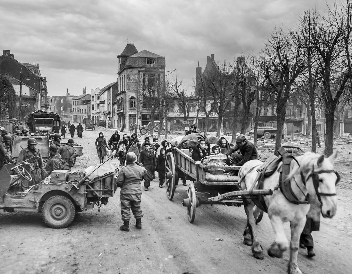 #39 Refugees evacuating the Belgian town of Bastogne, 1944.