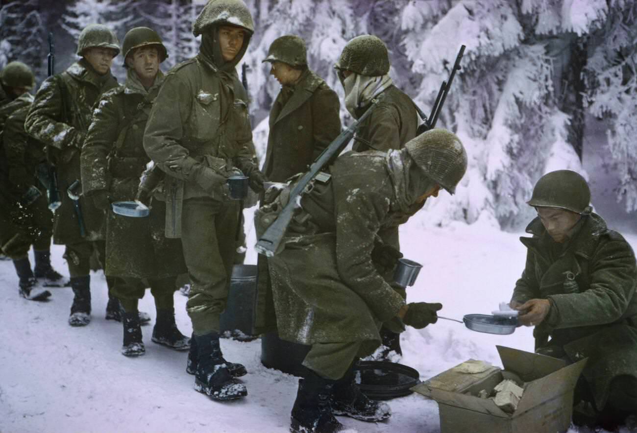#40 Soldiers receiving food at a field mess, 1945.