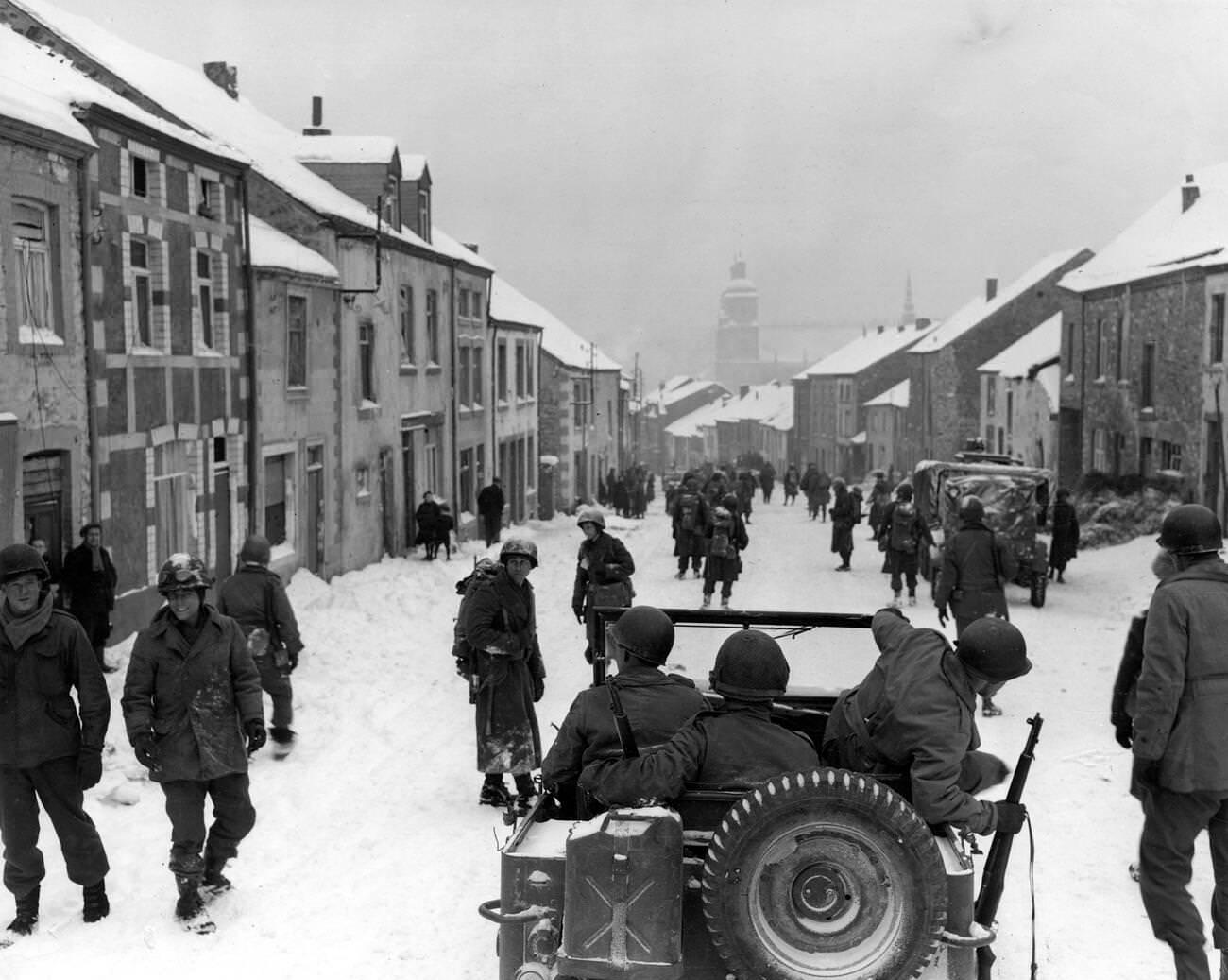 #61 American soldiers of the 87th Division enter the town of St Hubert in Belgium shortly after the German occupiers had left, 1945.