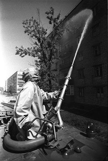 #14 After the evacuation of Chernobyl on 5 May, 1986, liquidators wash the radioactive dust off the streets using a product called “bourda”, meaning molasses. Chernobyl had about 15,000 inhabitants before the accident.