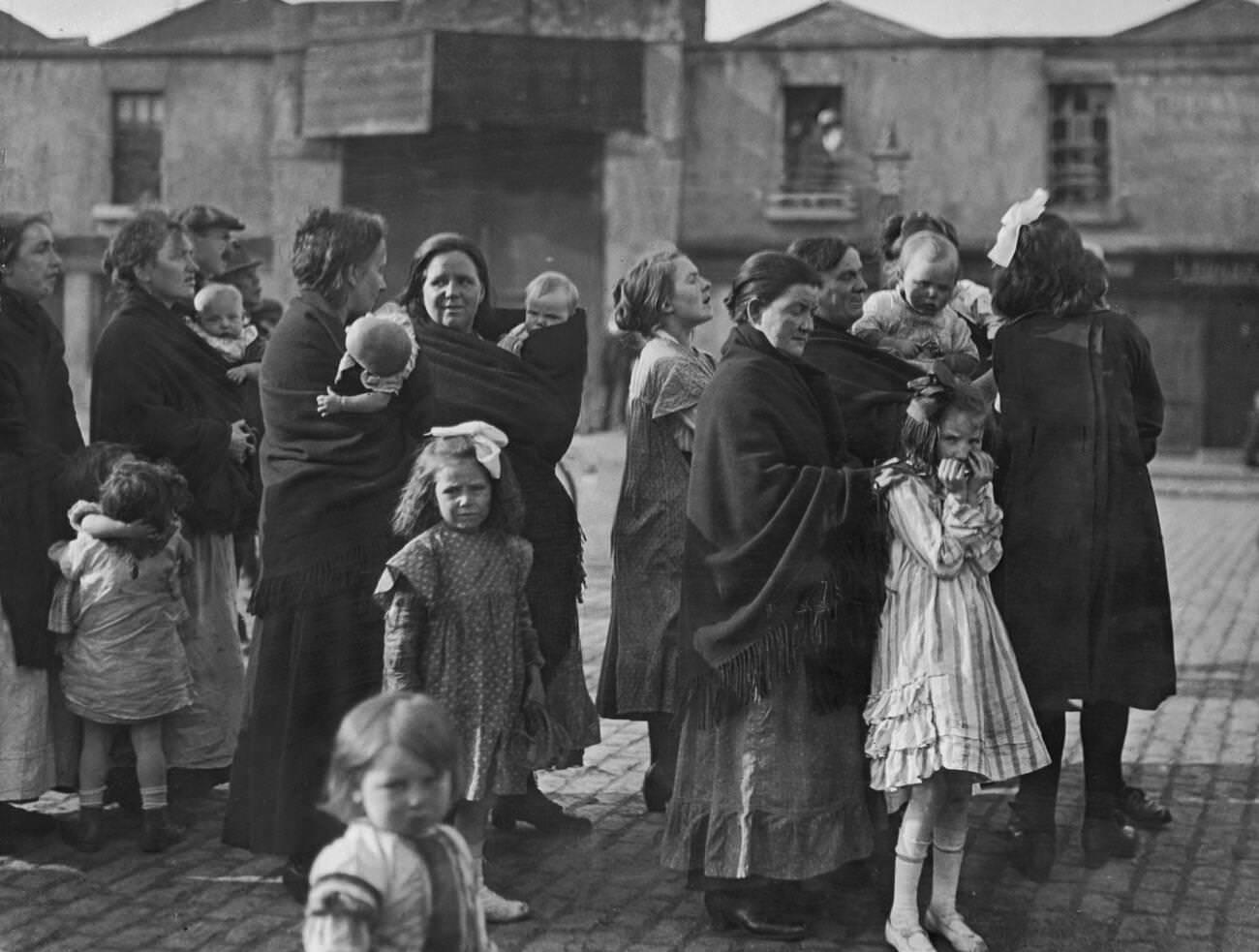 #42 Irish mothers and their babies listening to speeches from the Panel Coalition candidate in mid Dublin during the 1922 Irish elections, 1922.