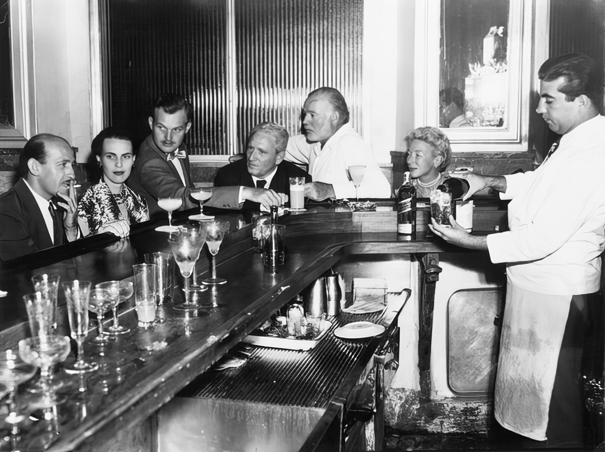 #8 Hemingway, his fourth wife Mary, and Spencer Tracy partying in Havana, circa 1955