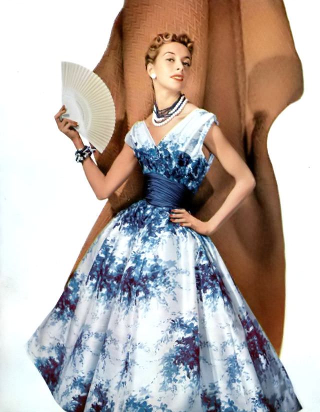 #12 Marie-Thérèse in a silk floral print dress by Pierre Balmain, 1954.