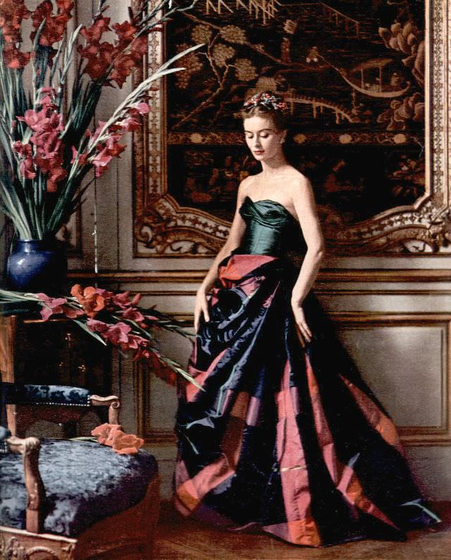 #1 Gigi Terwalgne in an evening gown with a voluminous plaid taffeta skirt and a green taffeta bustier that laces up the back by Pierre Balmain, 1951.