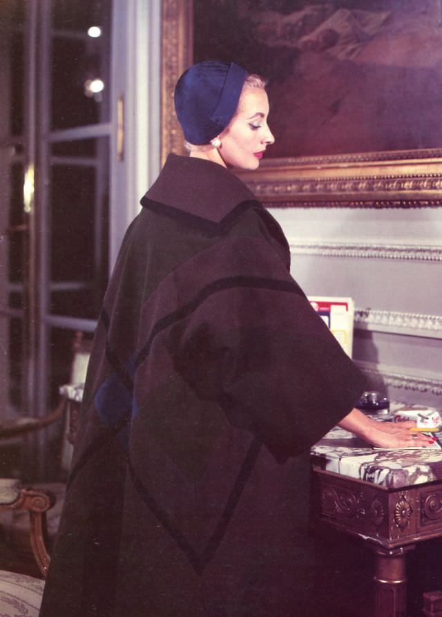 #20 Marie-Thérèse in Balmain’s plaid wool coat of assembled panels, 1957.