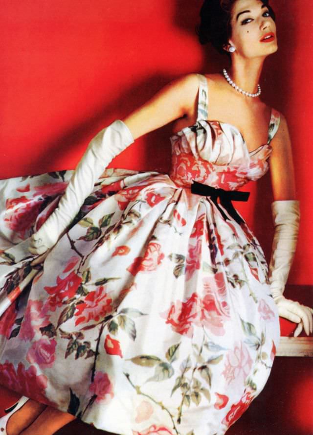 #25 Simone d’Aillencourt in a pink crepe de chine floral party dress by Pierre Balmain, 1957.