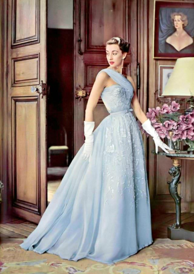 #2 Marie-Thérèse in an evening gown of pale blue embroidered chiffon by Pierre Balmain, 1952.