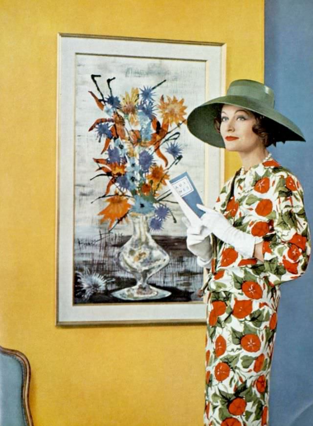 #29 Bronwen Pugh (Lady Astor) in a silk floral print ensemble by Pierre Balmain, 1958.