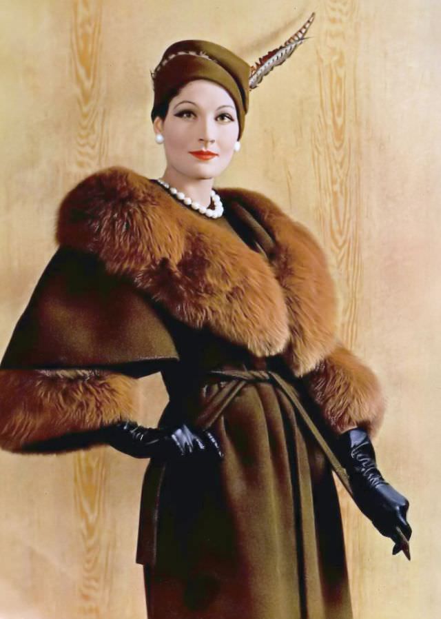 #30 Bronwen Pugh (Lady Astor) in a wool wrap coat with a red fox collar and cuffs by Pierre Balmain, 1958.