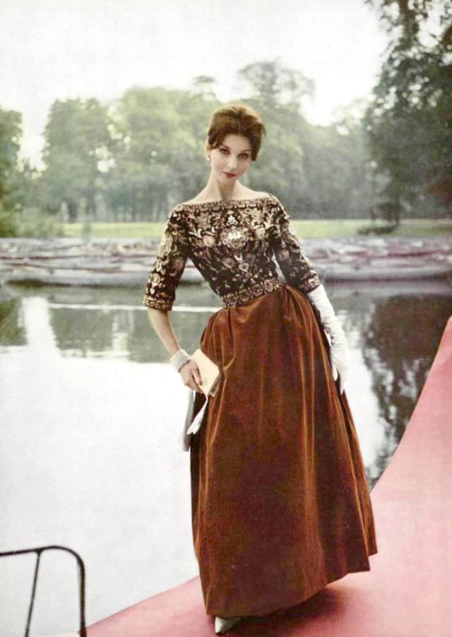 #38 A model in a long velvet skirt reminiscent of the Renaissance, the bodice is richly embroidered chiffon, by Pierre Balmain, 1959.
