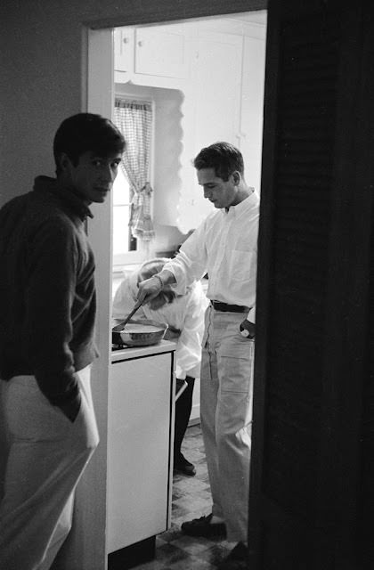 #10 Paul Newman cooking eggs for Anthony Perkins at his Hollywood home, 1958.