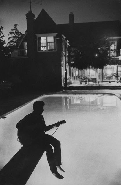 #9 Ricky Nelson playing guitar at his family’s Hollywood home, 1958.