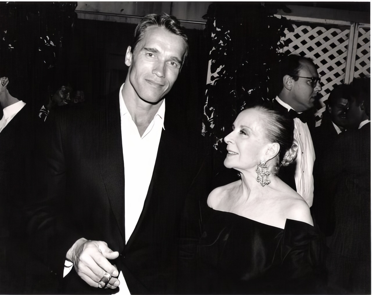 #9 Arnold Schwarzenegger, as handsome as he ever was in his pre-govenor days admired by Mrs. Vincent Minnelli, step-mother of Liza, at a private reception in Beverly Hills.