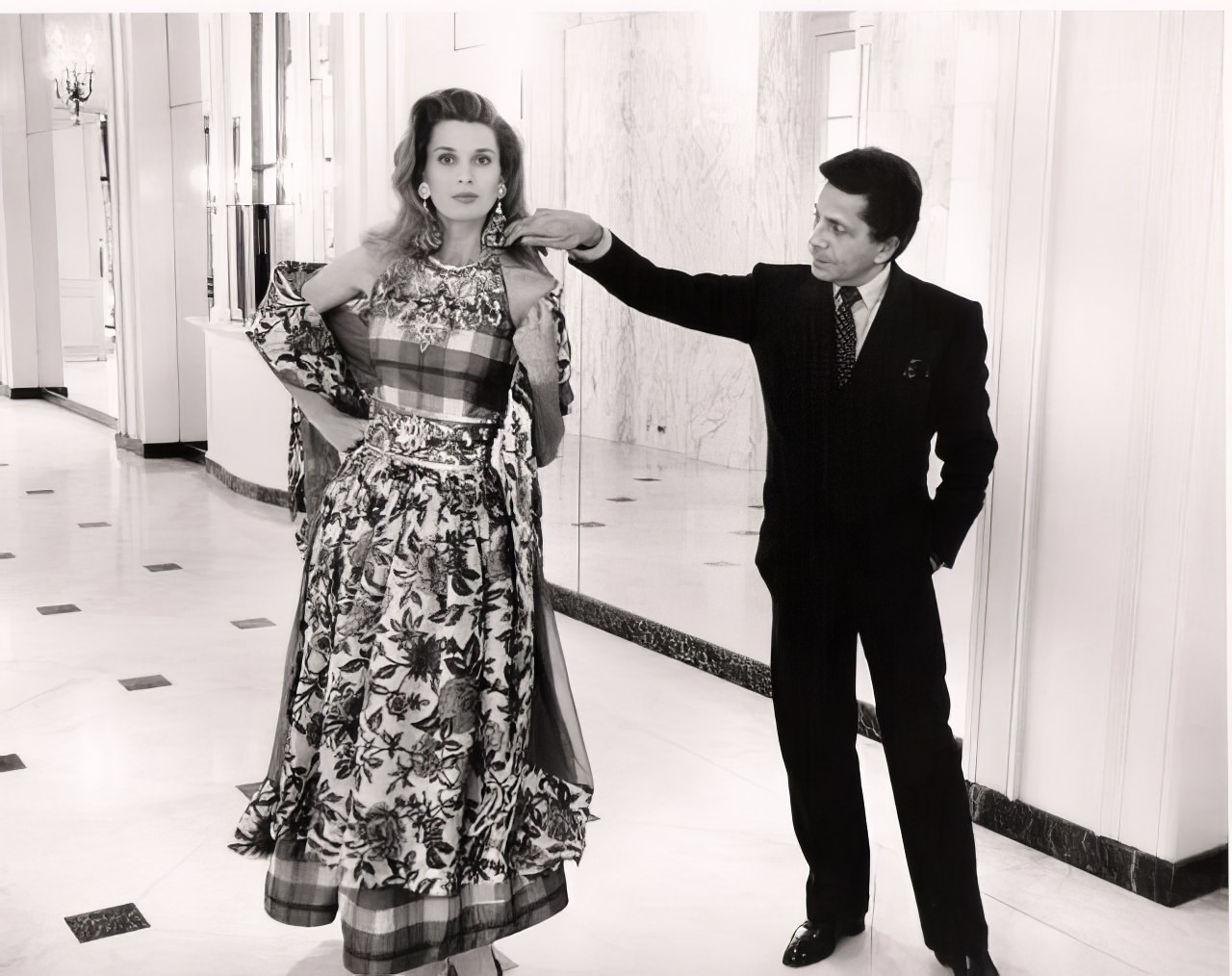 #46 Valentino with model in the lobby of the Beverly Wilshire Hotel during a rare visit to L.A.